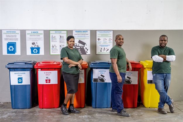 L-R: Employees Nosipho Zulu and Thabanie Mngoma and business development partner Lungani Manqele with the bins where all waste is collected for recycling.