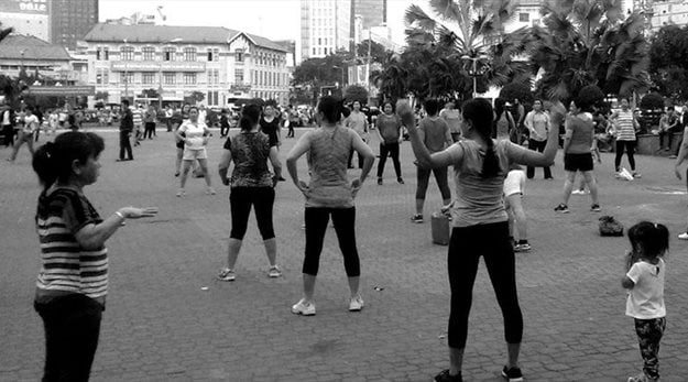 The citizens of Ho Chi Minh City hold free exercise classes in the new public park near Ben Thrah Market. Photo credit: Patrick McInerney