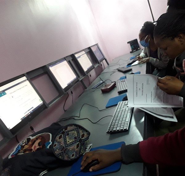 Beneficiaries completing modules for Computer Training through SayPro’s online academy
