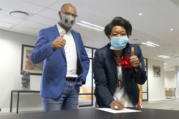 Property Point founder Shawn Theunissen and Portia Tau-Sekati, CEO of the PSCC, sign MoU