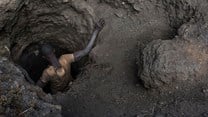A creuseur or digger, descends into a tunnel at the mine in Kawama, Democratic Republic of Congo. Michael Robinson Chavez/The Washington Post via Getty Images