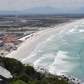 Muizenberg beach is eerily quiet on a hot summer’s day, 29 December 2020. If we want to save lives and life to go back to normal we need to embrace vaccines.