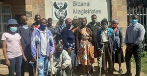 Litigation consultant, Zolile Shude, (far right) is concerned about the repeated postponement of the trial of five men who allegedly took part in attacks on people opposed to the Xolobeni Mineral Sands Project on the Wild Coast in December 2015. He is pictured here with victims and family members. Photo: Fred Kockott
