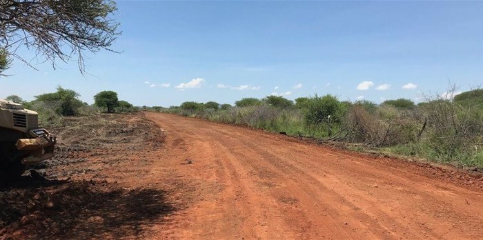 This road leads to the site where Ikwezi Vanadium is carrying out bulk sampling operations. The area is guarded by a private security company. GroundUp was not allowed to go beyond the security point. Photo: Masego Mafata