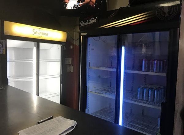 Empty fridges mark the alcohol ban at Yalta’s Pub and Grill in Parow. Photo: Tariro Washinyira