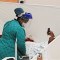 A health worker treats a patient at a temporary field hospital set up by Medecins Sans Frontieres (MSF) during the coronavirus disease (Covid-19) outbreak in Khayelitsha township near Cape Town, South Africa, July 21, 2020. REUTERS/Mike Hutchings