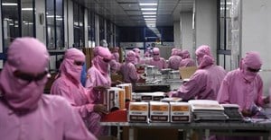 Workers at India’s biggest syringe manufacturer ramp up production in September 2020 in race to meet Covid-19 vaccine-driven demand. Photo by SAJJAD HUSSAIN/AFP via Getty Images