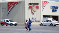 A couple leaves Tiger Brands factory shop in Germiston, Johannesburg, South Africa, 5 March 2018. Reuters/Siphiwe Sibeko