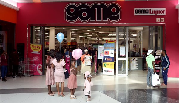 Shoppers stand outside the outlet for Massmart-owned Game Store in Polokwane, Limpopo province, South Africa, 1 June 2019. Reuters/Siphiwe Sibeko