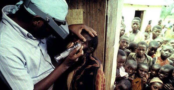 A health worker examines a child for signs of trachoma Joe McNally/Getty Images
