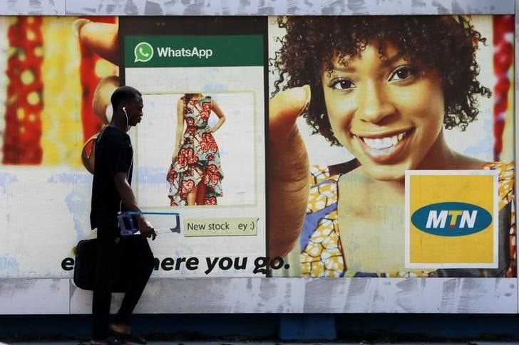 A man walks past an advertising poster for MTN telecommunication company along a street in Lagos, Nigeria, file. Reuters/Afolabi Sotunde