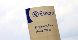 An Eskom logo is seen at the entrance of their head offices in Sunninghill, Sandton,file. Reuters/Siphiwe Sibeko
