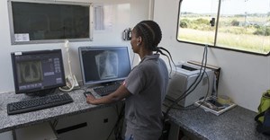 Healthcare worker, Boitsholo Mfolo, inside the digital x-ray truck at one of Africa Health Research Institute’s mobile screening camps in rural KwaZulu Natal, South Africa. Samora Chapman/ Africa Health Research Institute