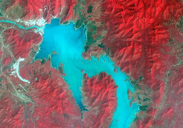 The Blue Nile River is seen as the Grand Ethiopian Renaissance Dam reservoir fills near the Ethiopia-Sudan border, in this broad spectral image taken 6 November 2020. Nasa/METI/AIST/Japan Space Systems, and US/Japan Aster Science Team/Handout via Reuters