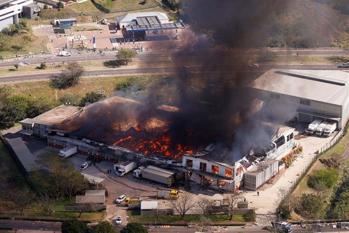 A general view of a burning warehouse after violence erupted following the jailing of former South African President Jacob Zuma, in Durban, South Africa, 14 July 2021. Reuters/Rogan Ward