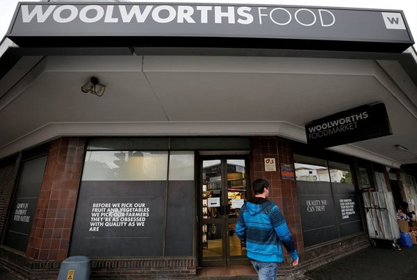 A man walks past an outlet of retailer Woolworths in Cape Town, South Africa. Reuters/Mike Hutchings/File Photo
