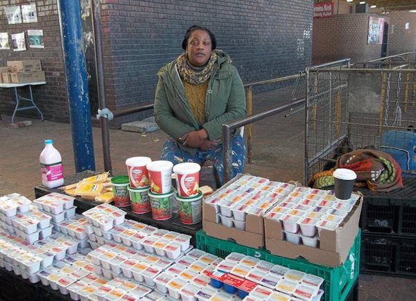 Tafadzwa Chakachaka sells cheese and yoghurt at the Bellville taxi rank. She is struggling to find buyers because the taxi violence has chased her customers away. Photos: Vincent Lali.