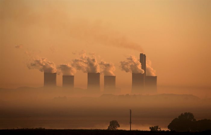 Steam rises at sunrise from the Lethabo Power Station, a coal-fired power station owned by state power utility Eskom near Sasolburg, South Africa, 2 March 2016. | Source: Reuters/Siphiwe Sibeko/File photo