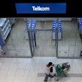 A shopper walks past a Telkom shop at a mall in Johannesburg, file. REUTERS/Siphiwe Sibeko