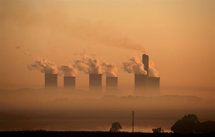 Steam rises at sunrise from the Lethabo Power Station, a coal-fired power station owned by state power utility Eskom near Sasolburg. Reuters/Siphiwe Sibeko