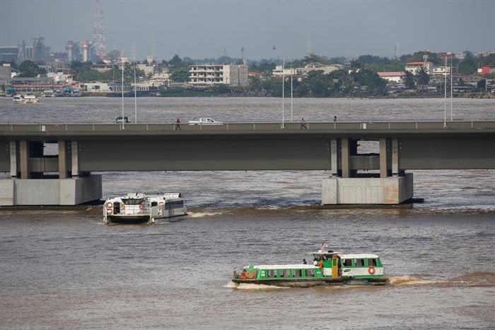Modern boats from several lagoon transport companies sail on the Ebrie Lagoon in front of the Felix Houphouet-Boigny Bridge in the economic capital Abidjan, Ivory Coast. Reuters/Luc Gnago