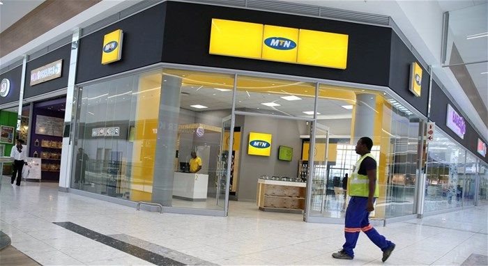 A worker walks past an outlet of South Africa's MTN Group in Johannesburg, South Africa, 23 February 2016. Reuters/Siphiwe Sibek/File Photo