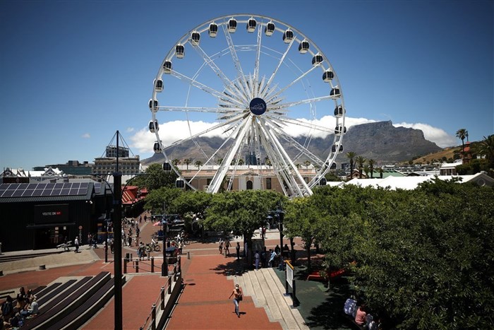 Visitors are seen in the popular Waterfront district, as numbers of international tourists decline following recent coronavirus disease (COVID-19) travel restrictions, in Cape Town, South Africa, December 7, 2021. REUTERS/Mike Hutchings