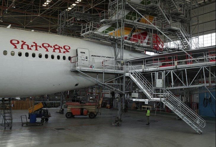 A worker is seen near of an Ethiopian Airlines passenger carrier to be converted into a cargo plane at the Ethiopian Airlines hangar within the Bole international airport in the Addis Ababa, Ethiopia 15 May 2020. Reuters/Giulia Paravicini
