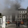 Firefighters work among the smoke after a fire broke out in the Parliament in Cape Town, South Africa. Reuters/Sumaya Hisham
