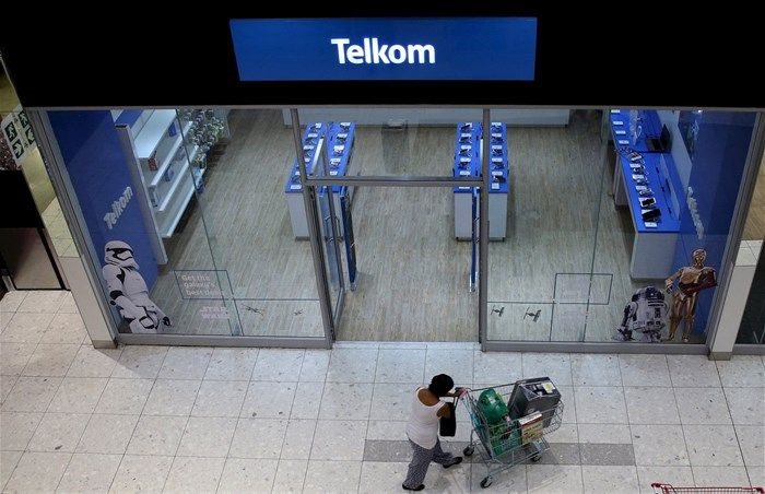 A shopper walks past a Telkom shop at a mall in Johannesburg on 26 February 2016. Reuters/Siphiwe Sibeko