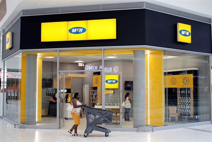 A shopper walks past an MTN shop at a mall in Johannesburg, South Africa. Reuters/Siphiwe Sibeko