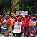Striking Clover workers marched through the streets of Sandton on Thursday. Photo: Masego Mafata.