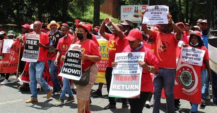 Striking Clover workers marched through the streets of Sandton on Thursday. Photo: Masego Mafata.
