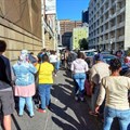 Source: © Groundup Photo: Marecia Damons  People waiting for hours outside Home Affairs in Barrack Street, Cape Town.