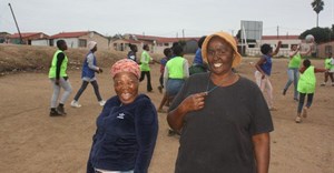 Unemployed women turn rubbish dump into netball field for young girls