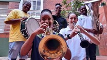 Image by Illa Thompson: Tshepho Ntswelengwe of KZN Philharmonic and Andile Mthethwa, Sanele Qwabe, Mendy Mchunu and Ella Scharler of the KZN Youth Wind Band