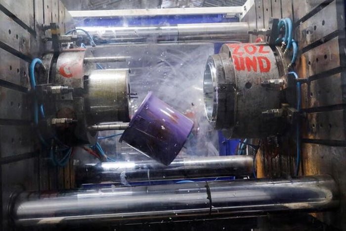 A bucket made from recycled plastic comes out of the mould after cooling at the Simpa's factory in Dakar, Senegal. Source: Reuter/Ngouda Dione