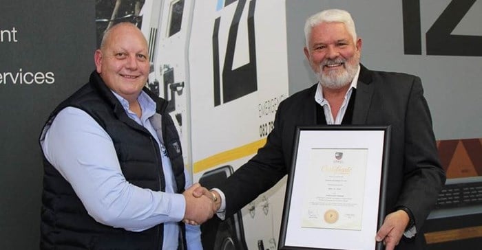 Source: Supplied. IziCash Solutions chief executive officer, Albert Erasmus receives the official certificate of membership from Grant Clark, head of the Cash-in-Transit Association of SA.