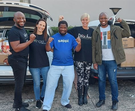 Lending a helping hand to load all the donations into the vehicles for the two beneficiary organisations are the ‘Men of muscle’ Chief Sambo, Richman Ndlovu and  Lungisani Buthelezi  from Sappi