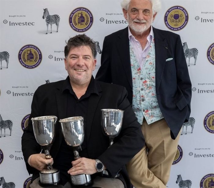 Anton Swarts from Spier Wine Farm with his collection of awards and chairman of the judges, Michael Fridjhon. Source: Supplied