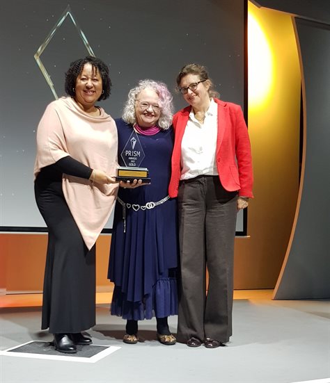 From left to right: Flow’s Edwina van der Burg, Caroline Smith and Sue Blaine with a gold award at the 2022 Prisms
