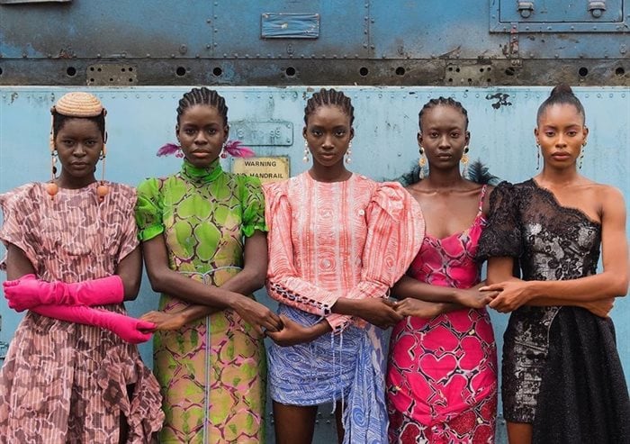 Models holding hands, Lagos, Nigeria, 2019 by Stephen Tayo. Courtesy Lagos Fashion Week. Source: V&A