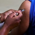 Origin: Supplied.  Reuters.  A healthcare worker administers the Pfizer coronavirus disease (Covid-19) vaccine to a man, amid the spread of the Omicron variant of SARS-CoV-2, in Johannesburg, South Africa.