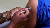 Source: Supplied. Reuters. A healthcare worker administers the Pfizer coronavirus disease (Covid-19) vaccine to a man, amidst the spread of the SARS-CoV-2 variant Omicron, in Johannesburg, South Africa.