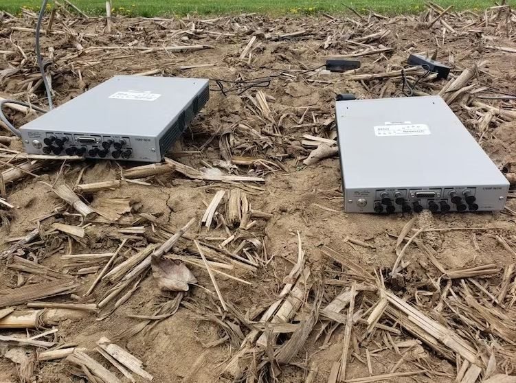 Using software-defined radios to detect soil measurement signals. These radios can adjust their operating frequencies in response to soil moisture changes. In actual operation, the radios are buried in the soil. Abdul Salam,