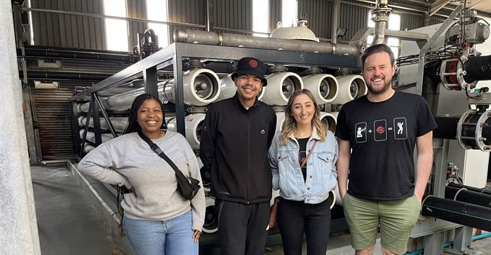 Image supplied. The 5 FM 5 Drive team in Mossel Bay at a desalination plant on the Heritage Tour