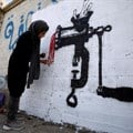 Source: Reuters. An artist paints a mural as part of the &quot;cholera&quot; campaign to depict the suffering of cholera patients in Sanaa, Yemen; April 25, 2019.