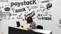 Source: Reuters. A staff member works at the reception of the paystack online payment company in the government reserved area in Ikeja, in Lagos, Nigeria, June 21, 2018.