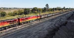 A Transnet Freight Rail train is seen next to tons of coal mined from the nearby Khanye Colliery mine, at the Bronkhorstspruit station, in Bronkhorstspruit, around 90 kilometres north-east of Johannesburg, South Africa, April 26, 2022. REUTERS/Siphiwe Sibeko