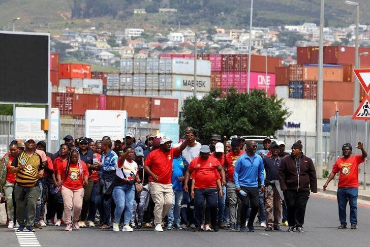 Workers at South Africa's state-owned logistics firm Transnet demonstrate for a second week outside the Port of Cape Town as they continue on a nationwide strike action that could paralyse ports and freight rail services in Cape Town, South Africa, October 17, 2022. REUTERS/Esa Alexander